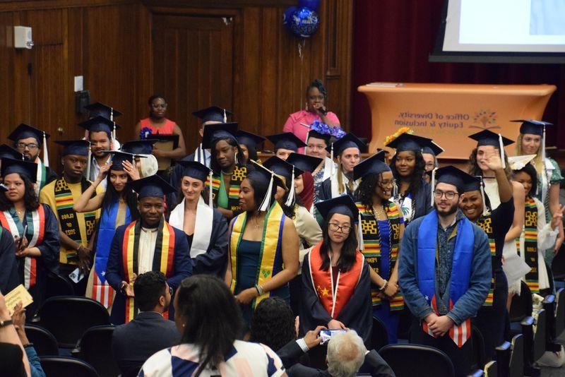 cultural graduation students standing