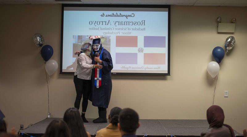 two people hugging at cultural graduation